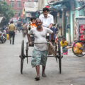 Hand-pulled rickshaws in Kolkata are one of the last remaining examples of this traditional form of transport in India. Rickshaw pullers manually carry passengers through narrow streets and busy neighborhoods, often under physically demanding conditions and for very low income. They are mainly found in older parts of the city and have become a symbol of social inequality as well as a reminder of Kolkata’s colonial-era urban history. Despite ongoing criticism of the working conditions, they still serve as a practical means of transport in densely populated residential areas where larger vehicles cannot easily pass.